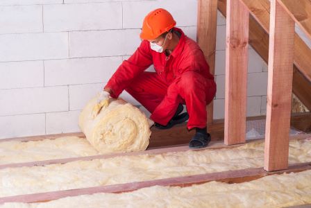 Image of person installing loft insulation