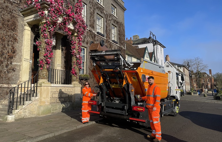 Waste operatives with new food waste collection vehicle