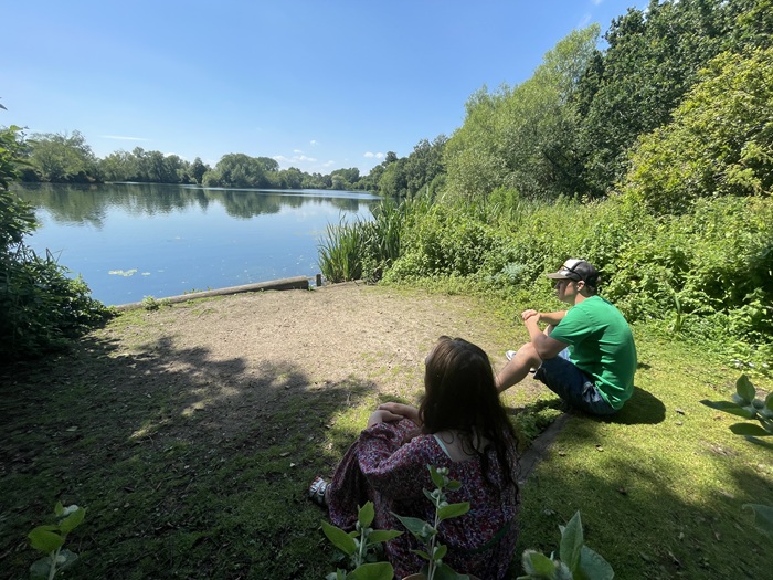 A mother and son look out over the lake at West Stow Country Park