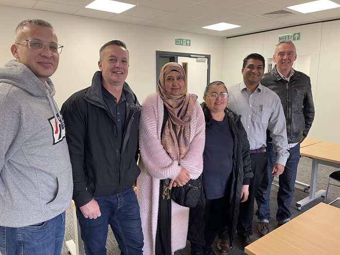 Adult learner Michal Kamieniak, Cllr Andrew Martin, adult learners Frozan Mirzi and Gizelda Maria Veras De Araujo, Cllr Indy Wijenayaka and ESOL lecturer Paul Corey.