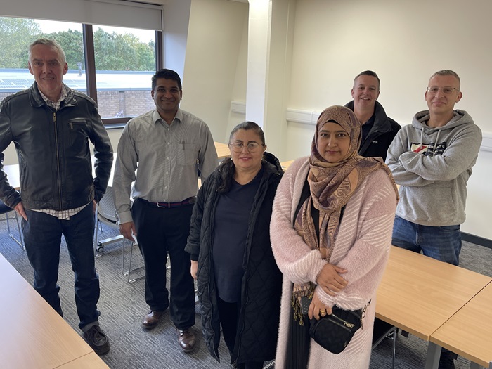 ESOL lecturer Paul Corey, Cllr Indy Wijenayaka, adult learners Gizelda Maria Veras De Araujo and Frozan Mirzi, and at the back Cllr Andrew Martin and adult learner Michal Kamieniak