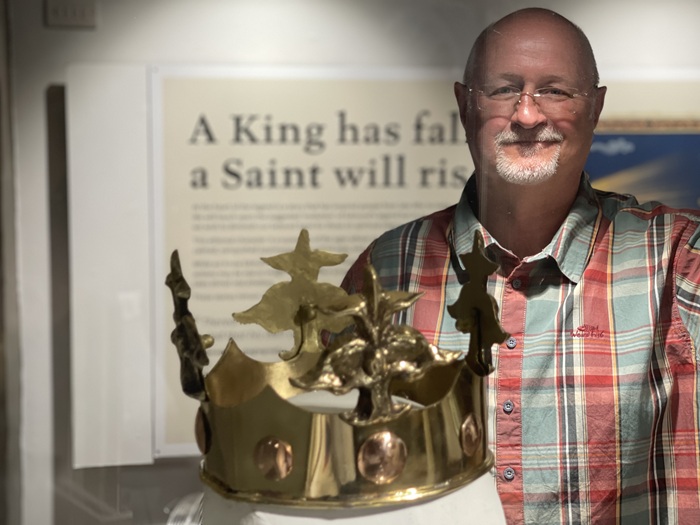 Cllr Ian Shipp, Cabinet Member for Leisure and Culture at West Suffolk Council at the Edmund and the Great Heathen Army exhibition at Moyse's Hall Museum. He is seen viewing a replica crown of St Edmund made by metallurgist Dr Steve Jones