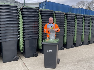 Cllr Dave Taylor with new green-lidded bins icon