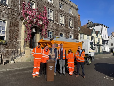 Cllr Taylor with operations team in front of new food waste collection lorry