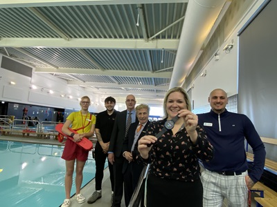 Staff and councillors showing AI technology at Mildenhall pool