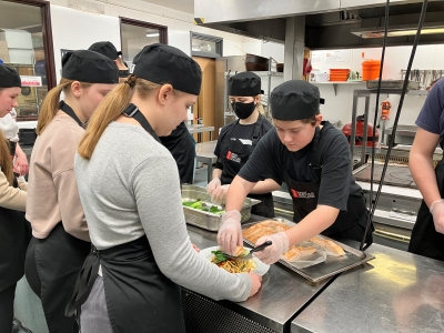 Students prepping food