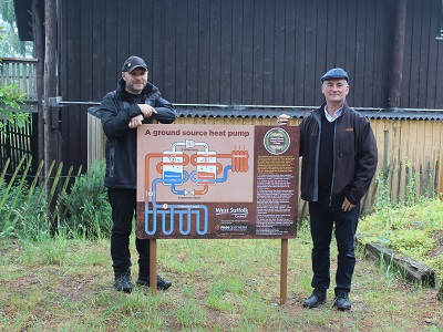 Lance Alexander, heritage operations manager at West Stow Anglo-Saxon Village, with Guy Ransom, commercial director of Finn Geotherm by the storyboard at West Stow which shows how the new heat pump system works.