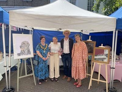Anna Sutton, overall winner of the Young Market Traders regional heat 2024 with judges.