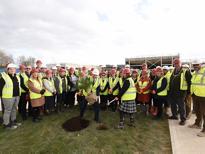 Mildenhall College Academy students Jessie Beale and MP Matt Hancock plant a tree to mark the topping out of Mildenhall Hub