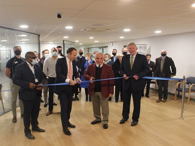 Brandon Leisure and Health Hub user Colin Aldrich cuts the ribbon watched on by West Suffolk MP Matt Hancock, Leader of West Suffolk Council Cllr John Griffiths, health officials and Abbeycroft Leisure staff