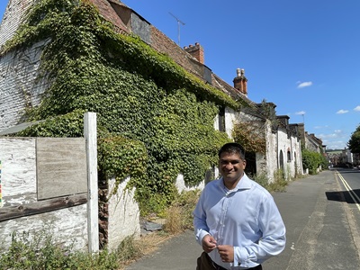 Cllr Indy Wijenayaka outside Queensbury Lodge in Newmarket back in August this year