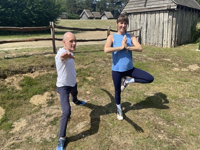 Robin Taylor and yoga instructor Tracey Clay perform yoga poses at West Stow Country Park. icon