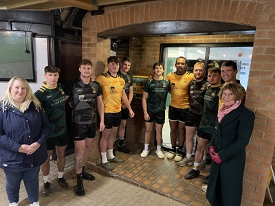 Cllr Jo Rayner and Cllr Julia Wakelam with members of Bury St Edmunds Rugby Club and the community defibrillator