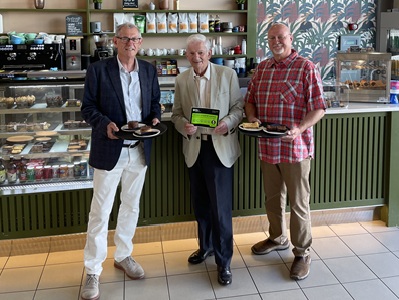 Cllr Cliff Waterman,  Cllr Gerald Kelly and Cllr Ian Shipp at Apex cafe with goods from Gee Gee Bakes and the Friendly Loaf icon