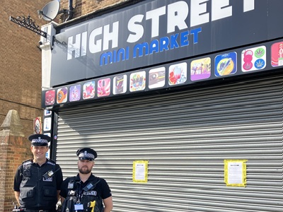 The Newmarket High Street Mini Market - one of three shops in Newmarket that have been closed for three months after selling illegal vapes and tobacco despite a previous warning. Pictured are PC Tim Bond and Sgt Chris Button. icon