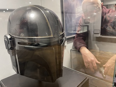 Cllr Ian Shipp, West Suffolk Council's Cabinet Member for Leisure and Culture looks at a production made Mandalorian helmet believed to have been worn by Pedro Pascal from Season 1. icon