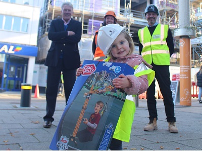 Mimi with her own "giant crane", watched on by Cllr John Griffiths, Leader of West Suffolk Council, crane operator Kristy Swallow, and Barnes Construction senior site manager Steven Rouse